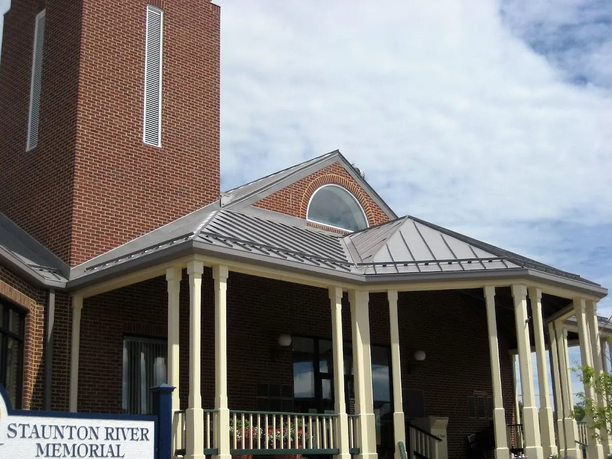 Skilled roofing craftsmen working on a residential roof in Noyack